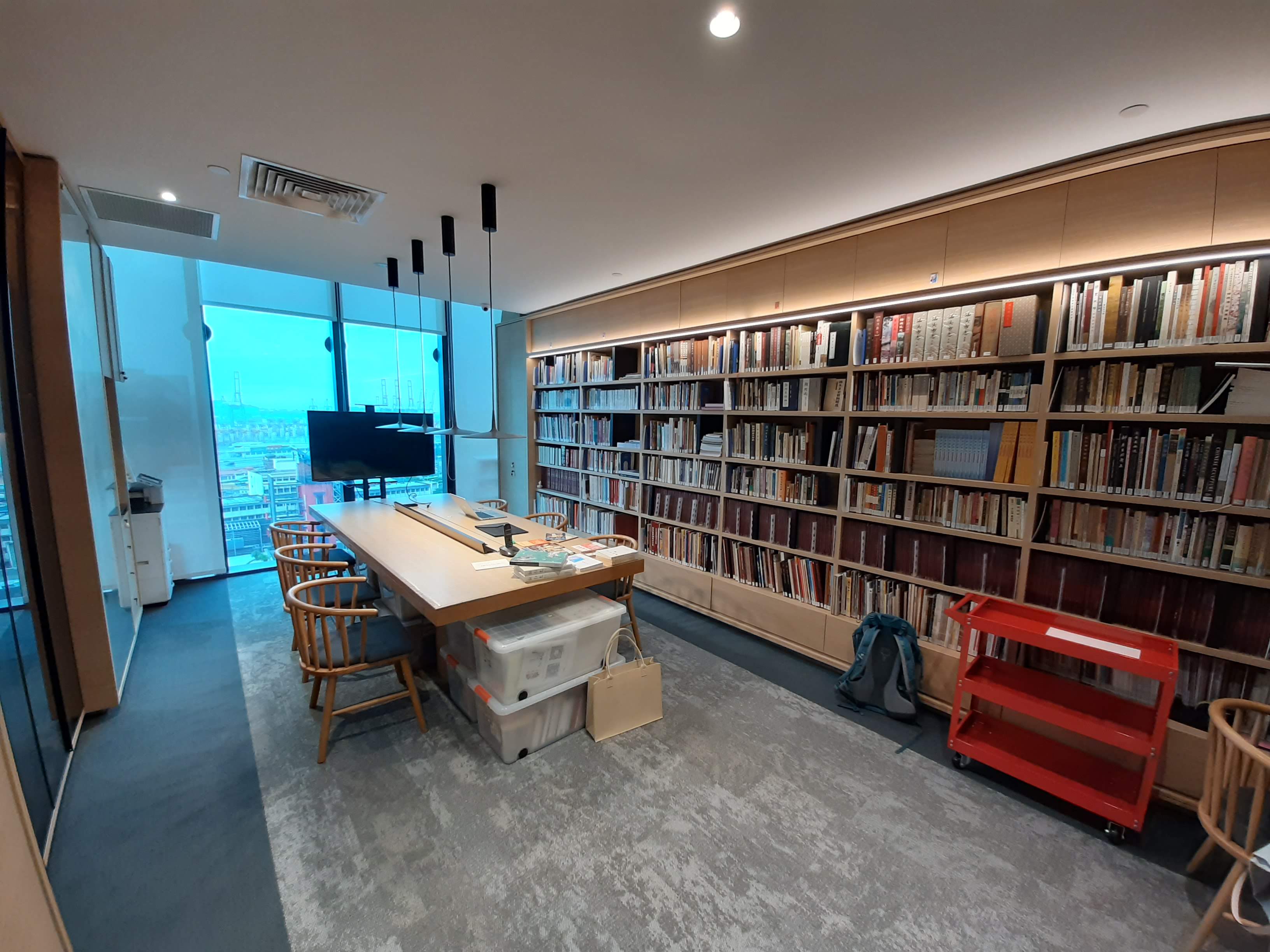 Premises of Yeo Khee Lim TCRC; large table in the middle, bookshelves on the sides, and a large window at the end of the room.